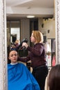 Stylist Drying Hair of Woman with Blow Dryer Royalty Free Stock Photo