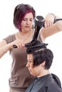 Stylist drying woman hair Royalty Free Stock Photo