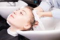 Stylist drying woman hair with towel in salon Royalty Free Stock Photo