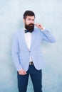 Stylist fashion expert. Suit style. Fashion trends for groom. Groom bearded hipster man wear light blue tuxedo and bow