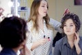 Stylist makeup artist doing makeup and hair in a beauty salon.