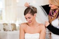 Stylist pinning up a bride's hairstyle Royalty Free Stock Photo