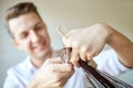 Stylist with scissors cutting hair tips at salon Royalty Free Stock Photo