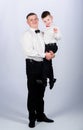 Stylist in tuxedo style. Wedding party. father and son in formal suit. happy child with father. business meeting. small Royalty Free Stock Photo