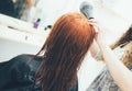 Stylist working in the beauty salon, haircut and hair styling Royalty Free Stock Photo