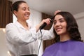 Stylist working with client in salon