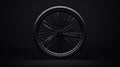 stylized black bicycle tire and wheel with shadowed spokes in a dark minimalist studio setting Royalty Free Stock Photo