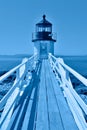 Stylized blue hour image of Marshall Point Lighthouse, Maine, in classic blue 2020 color of the year, symbol of calm, peace, and Royalty Free Stock Photo