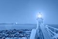 Stylized blue hour image of Marshall Point Lighthouse, Maine, in classic blue 2020 color of the year, symbol of calm, peace, and Royalty Free Stock Photo