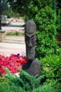 Stylized bust statue in public garden