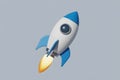 Cartoon Rocket Launching with Blue and White Design and Fiery Exhaust Royalty Free Stock Photo