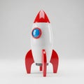 Cartoon- Style Rocket Ship with Red Fins and Nose Cone on White Background Royalty Free Stock Photo