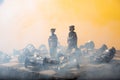 Stylized chess pieces on a board with orange background, smoke and selective focus