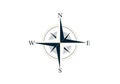 Stylized compass rose featuring four cardinal directions: North, South, East, and West. The design Royalty Free Stock Photo