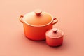 Orange And Red Cooking Pots With Lids On Peach Background. 3D Render Kitchen Utensils For Cooking Recipe Food Blog Or Culinary C Royalty Free Stock Photo