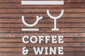 Stylized cup of coffee and a glass of wine on a wooden background. The words coffee and wine. Outdoor cafe signboard