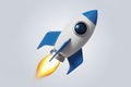 A 3D cartoon rocket blasting off with blue fins and a bright orange flame Royalty Free Stock Photo