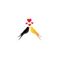 Two birds kissing with red hearts, symbolic of love and romance Royalty Free Stock Photo