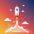 A stylized illustration of a rocket launch symbolizes a startup. The rocket is red and Royalty Free Stock Photo