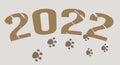 stylized inscription 2022 with traces of tiger paws