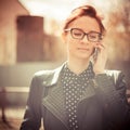 Stylized instagram colorized vintage fashion portrait of a young woman wearing glasses with beauty bokeh and small depth of f Royalty Free Stock Photo