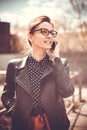 Stylized instagram colorized vintage fashion portrait of a young woman wearing glasses with beauty bokeh and small depth of f Royalty Free Stock Photo