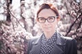 Stylized instagram colorized vintage fashion portrait of a young woman wearing glasses with beauty bokeh and small depth of f Royalty Free Stock Photo