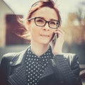 Stylized instagram colorized vintage fashion portrait of a young woman wearing glasses with beauty bokeh and small depth of f Royalty Free Stock Photo