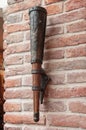 Stylized lamp in the form of the ancient torch on a brick wall Royalty Free Stock Photo