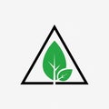 A stylized logo features two green leaves within a black triang Royalty Free Stock Photo