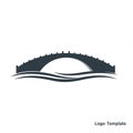 Stylized logo featuring a simple, arched bridge with small evenly spaced protrusions Royalty Free Stock Photo