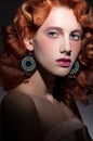 Stylized portrait of young beautiful red haired woman