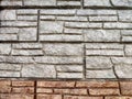 Stylized stone or brick plastic wall of different colors. Abstract Background, Texture, Pattern, frame, place for text Royalty Free Stock Photo