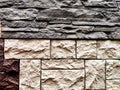 Stylized stone or brick plastic wall of different colors. Abstract Background, Texture, Pattern, frame, place for text Royalty Free Stock Photo