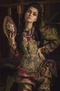 Stylized vintage portrait of young woman in ethno style Royalty Free Stock Photo