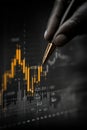 Close-up of a hand pointing with a pen at stock market data Royalty Free Stock Photo