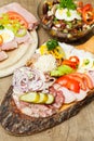 A styrian snack lying on a wooden table