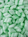 Styrofoam packaging chips or peanuts, green packing material background texture Royalty Free Stock Photo