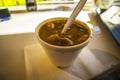 A styrofoam small cup of beef stew and blurred background Royalty Free Stock Photo