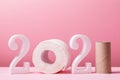 Styrofoam and toilet paper numbers in 2021 shape with copy space on pink background. A joke for the new year Royalty Free Stock Photo