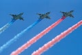 Su-25 attack planes fly with smoke trails