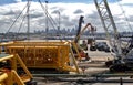 Sub sea modules used to support offshore platforms are lifted from the dock to a barge