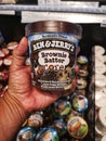 Subang Jaya, Malaysia - 20 February 2021 : Hand hold a BEN and JERRYS Brownie Batter Core ice cream for sell in the supermarket