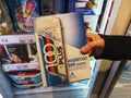 Subang Jaya,Malaysia-12 March 2022 : Hand hold a 100 PLUS Hydration Bar ice cream box for sell in the supermarket.