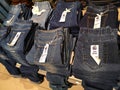 Subang Jaya,Malaysia-23 November 2021 : Blue jeans display for sale at Shopping Mall with selective focus