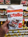 Subang Jaya, Malaysia - 22 November 2020 : Hand hold a packed of Nutella Ferrero hazelnut spread with cocoa in the supermarket.