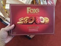 Subang Jaya,Malaysia - 28 October 2018 : Hand hold box of FOX'S Fabulously Biscuit Selection for sell in the supermarket