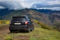 Subaru Forester stands on a dirt road in the mountains Royalty Free Stock Photo