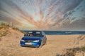 Subaru Impreza on wild beach near Prymorske, Ukraine Royalty Free Stock Photo