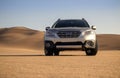 Subaru Outback standing in the middle of the desert. Namibia